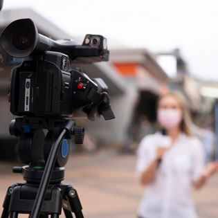 journalist in front of the camera