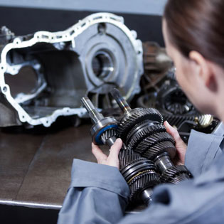 woman working on automotive equipment