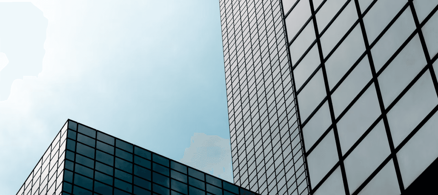Modern glass façades of commercial office buildings - illustrating the banking and finance sector