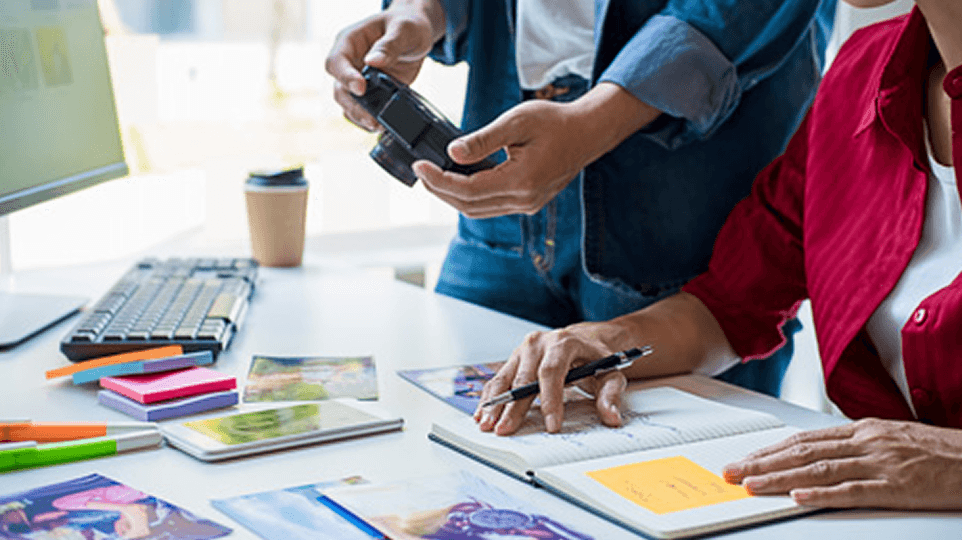 Creatives working on a graphic project in a communications agency