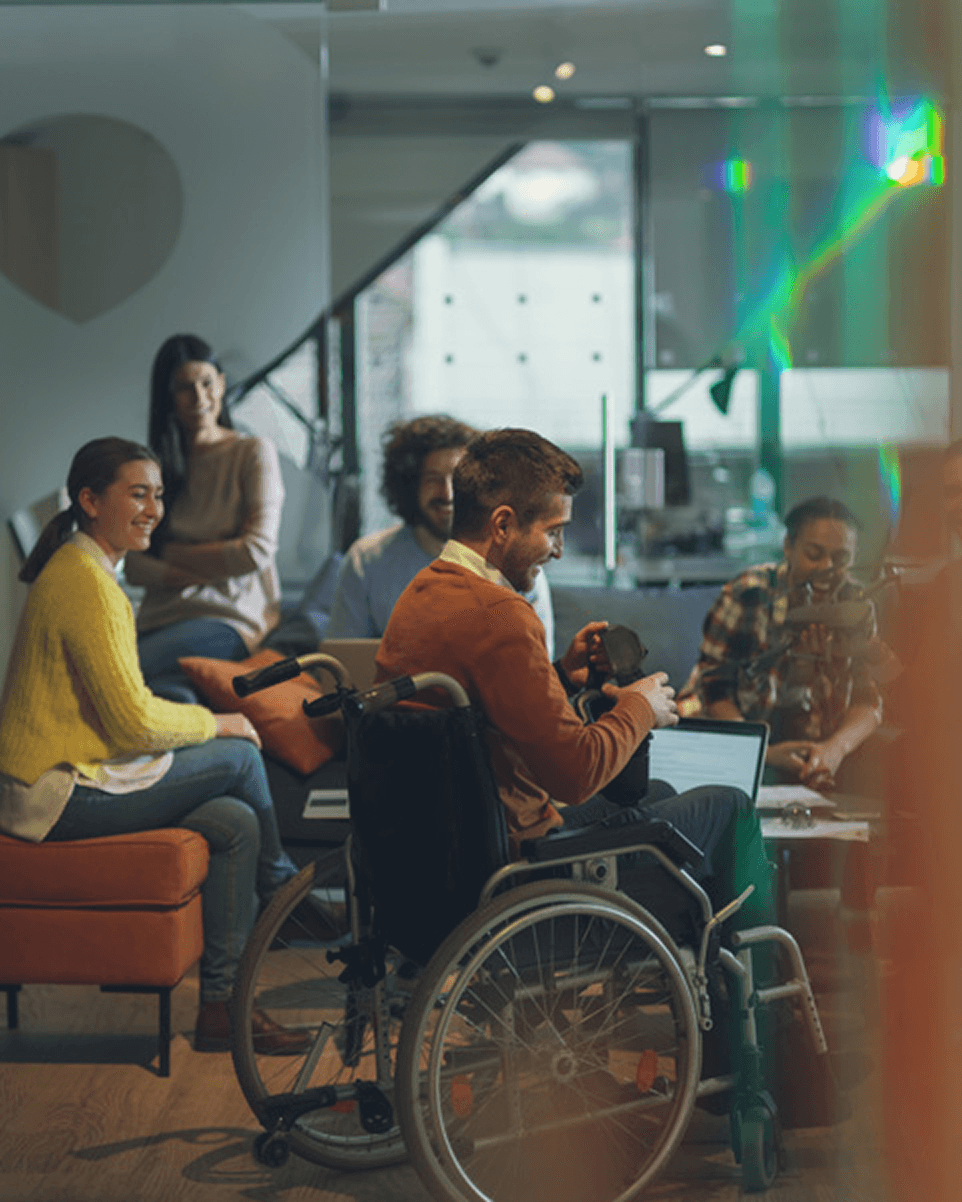A group of colleagues exchanging ideas in a workspace