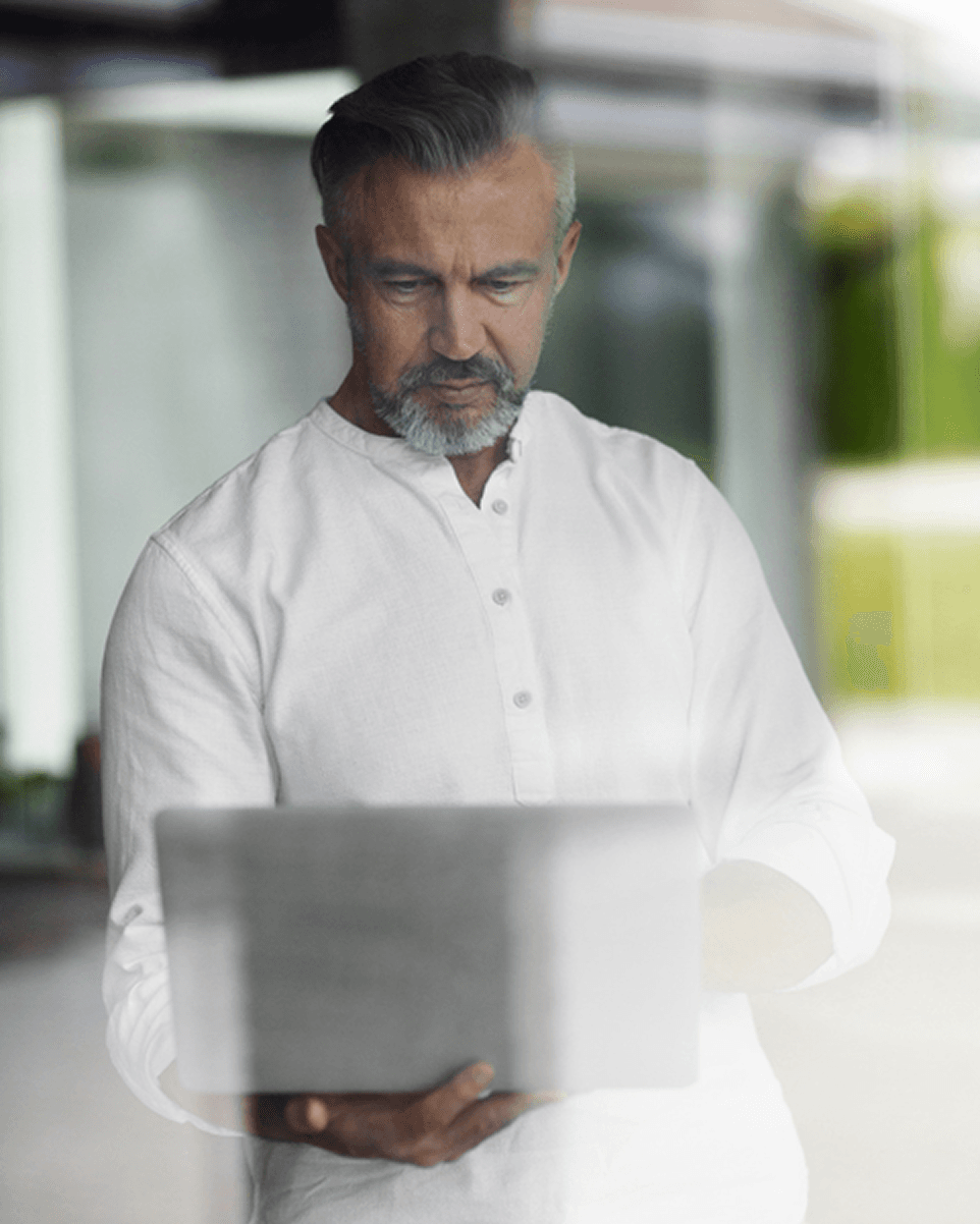 An executive reviewing information on a laptop